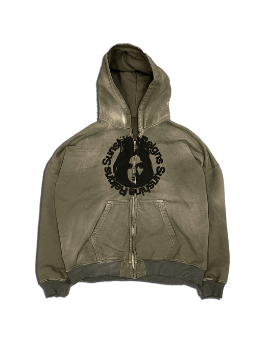 An olive Sunshine Reigns zip up hoodie with a screen print on the chest